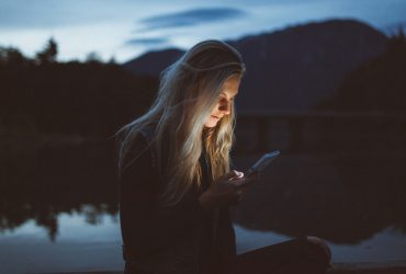 A girl going through her smartphone